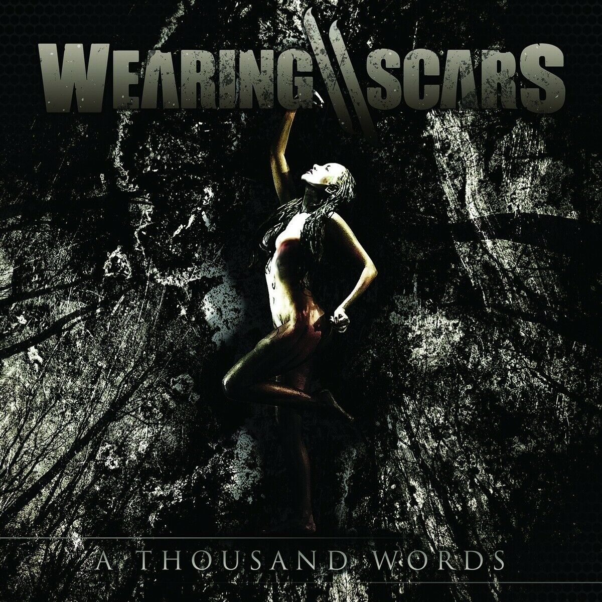 Wearing Scars - A Thousand Words in the group OUR PICKS / Blowout / Blowout-CD at Bengans Skivbutik AB (1387214)
